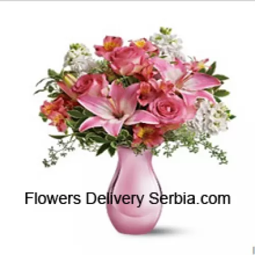 Pink Roses, Pink Lilies And Assorted White Flowers With Some Ferns In A Glass Vase