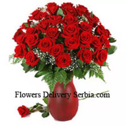 41 Red Roses And Seasonal Fillers In A Glass Vase