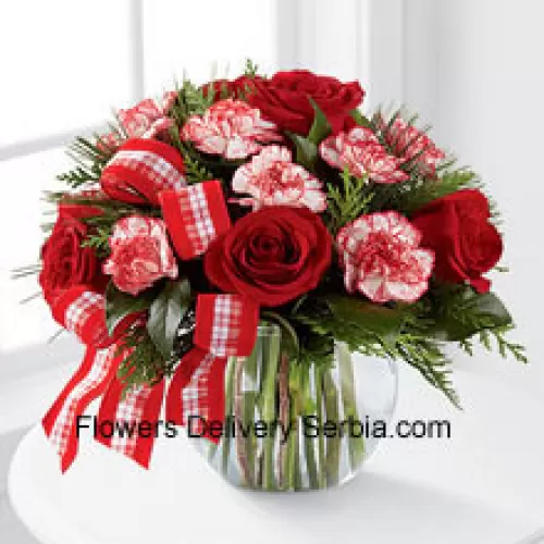Send warm wishes and bright sentiments for a wonderful holiday season! Rich red roses and peppermint carnations are delicately arranged with holiday greens to create a festive display. Arriving in a clear glass bubble bowl and accented with a red and white plaid ribbon, this arrangement is full of seasonal sophistication. (Please Note That We Reserve The Right To Substitute Any Product With A Suitable Product Of Equal Value In Case Of Non-Availability Of A Certain Product)